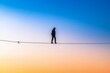 © Michael - Silhouette of a person walking on a tightrope representing balance in life.