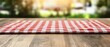© Ai Stock Lab - A red and white checkered tablecloth on a rustic wooden table in a serene outdoor setting.