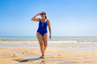 © Jacek Chabraszewski - Beautiful middle-aged woman walking on sunny beach Portugal, Algarve, praia Armona