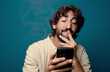 © kues1 - young adult bearded man with a smartphone