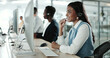 © peopleimages.com - Call center, computer and consulting with Indian woman in support office for customer service. Contact us, feedback and smile with happy person speaking on headset at work for advice or virtual help
