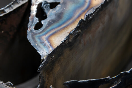 Industrial steel object with tempering colors pattern