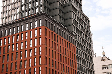 Exterior of modern building with many windows in city, low angle view