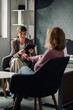 © Zamrznuti tonovi - Two businesswomen discussing using digital tablet in modern office