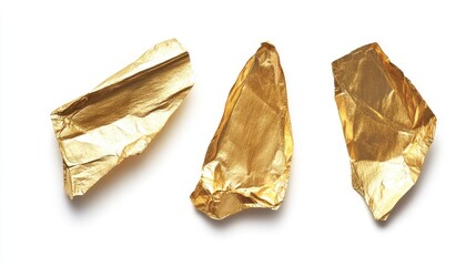 Poster - Crumpled gold foil pieces on white background showcasing texture and shine for design and packaging applications