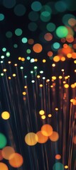 Poster - Fiber optic cables transmitting data create a mesmerizing bokeh effect with colorful orange, green, and turquoise lights against a dark background, highlighting modern communication