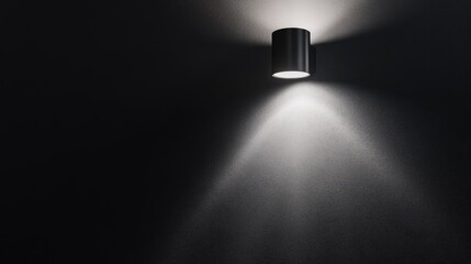 Poster - Minimalist monochrome wall lamp casting soft light on a dark textured wall creating a stylish and elegant ambiance