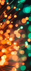 Poster - Fiber optic cables transmit light signals, creating a mesmerizing bokeh effect with orange and green hues, ideal for technology and communication concepts