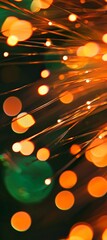 Poster - Fiber optic cables transmitting data as pulses of light create a captivating scene, showcasing blurred orange and green bokeh in the background, highlighting modern communication technology