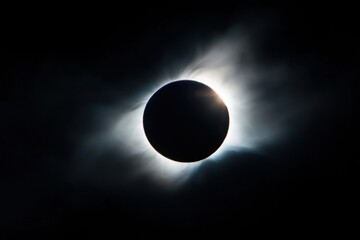 Wall Mural - a large black sun is in the center of the image