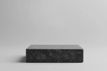 Fototapete - A minimalist black rectangular block on a light gray background, emphasizing simplicity.