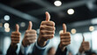 © deimos.az - Several business people giving thumbs up in an office setting