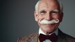 © Marta  Maksymiv - Close up portrait of grinning old-fashioned trendy elegant wealthy professional flirty trendsetter hipster grandpa sharp dressed with maroon bow-tie twisting white mustache isolated on grey background