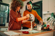 © Zamrznuti tonovi - Couple making dough in kitchen using stand mixer