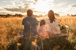 © kieferpix - Happy family parents child having a picnic in the park enjoying nature and time outdoors together