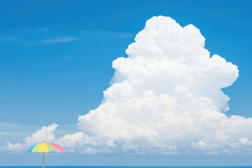 Wall Mural - Giant cumulus cloud over ocean with colorful beach umbrella under clear blue sky
