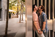 © ADDICTIVE STOCK - Romantic moment between a gay couple on a city sidewalk