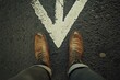 © Web - Individual Journey: Closeup of a Man's Leg in Motion Along a Pathway Marked by Directional Arrows
