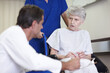 © peopleimages.com - Healthcare, talking and senior woman with disability, hospital and explaining of diagnosis and retirement. Clinic, medical professional and elderly person with wheelchair, doctor and conversation