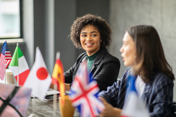 Leinwandbilder - A diverse group of professionals collaborate at a corporate office.