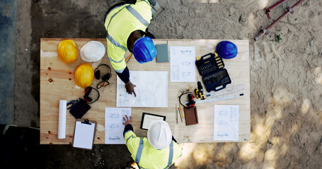 Poster - Construction site, tablet and business people with blueprint for architecture, building and planning. Above, engineer team and employees with ideas for industry renovation, infrastructure and meeting