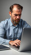 © Sergey - Caucasian bearded 40s middle-aged businessman worker employee man typing laptop feel failure upset with lost of information online error stressed look at computer screen suffer from headache pressur