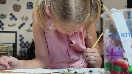 Wall Mural -  A young mother and her daughter enjoy a creative art session at home 