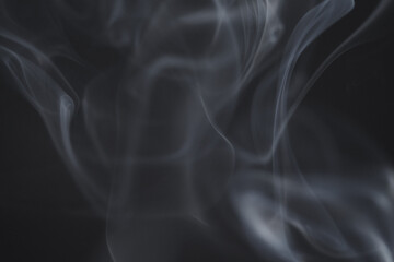 Wall Mural - close up of incense smoke as background. smoke is the gaseous products of burning materials especial