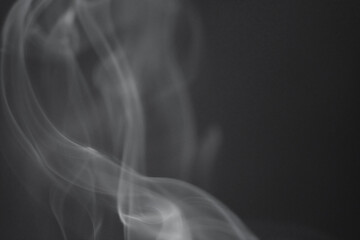 Wall Mural - close up of incense smoke as background. smoke is the gaseous products of burning materials especial