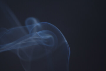 Wall Mural - close up of incense smoke as background. smoke is the gaseous products of burning materials especial