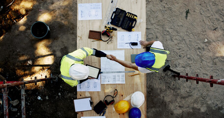 Aufkleber - Blueprint, construction and men at table with handshake, collaboration and inspection agreement from above. Architect, building team and contractor shaking hands with floor plan, partnership and deal