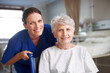 © peopleimages.com - Face, healthcare and senior woman with disability, smile and assisted living for recovery and caregiver. Happy, retirement and elderly person with nurse, service and help for patient in hospital