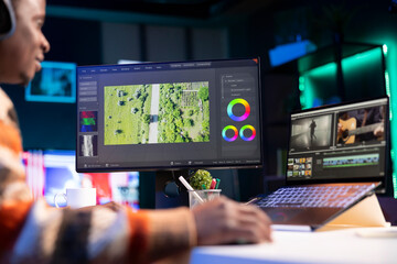 videography specialist editing new movie clip for video montage, working on freelance contract for p