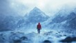 © kept - A person in a red jacket walking through a snowy landscape with mountains in the background.