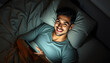 © Sergey - Close-up top above high angle view portrait of his he nice attractive brunet cheerful cheery guy lying in bed using cell free time chatting at night late evening home dark illuminated room house iso