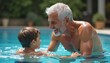 © Maryna - Senior Turkish man teaching grandson to swim in outdoor pool. Happy expressions, bonding. Grandson learning swimming skills. Man enjoying quality time with grandson. Healthy activity outdoors.