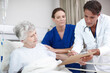 © peopleimages.com - Doctor, clipboard and senior patient in hospital bed for healthcare results, surgery information and bad news. Elderly woman, nurse and health support for diagnosis, illness update and compassion