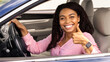 © Prostock-studio - Great Perfect Car. Happy African American Lady Showing Thumb Up Sign Gesture, Sitting In New Automobile Buying Modern Vehicle In Dealership Store, Enjoying Vacation, Looking At Camera Through Window