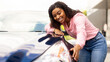 © Prostock-studio - Happy Car Buyer, New Car Owner Concept. Portrait Of Excited Young African American Lady Touching Her New Luxury Automobile After Purchase In Dealership Showroom Standing Outdoors. Selective Focus