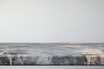 Poster - Smooth gray stone surface with a minimalist backdrop.