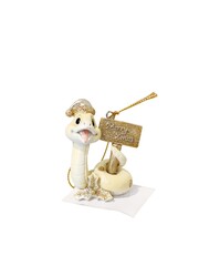 Poster - A small white ornament of a snake with a sign that says Merry Christmas