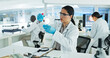 © peopleimages.com - Scientist, woman and blood test for virus, experiment and study results or medical information. Coworking, doctor and laboratory technician with research for bacteria development or pathology