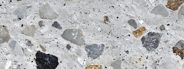 Poster - A close-up view of textured concrete with various aggregate stones.