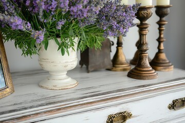Poster - A distressed white dresser with brass handles, adorned with a vase of lavender and antique candlesticks
