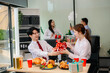 © laddawan - Christmas party! Festive decor, Santa hats, gifts, food, and cheerful coworkers bring joy and togetherness this holiday season