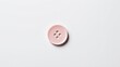 © TheStoodio - Minimalist pink button on white background, perfect for sewing or design themes.
