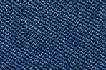 Denim fabric, classic color, for jackets, jeans and other clothes, close-up. Background, texture.