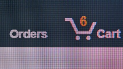 close up macro shot of computer monitor online shopping store shopping cart been ordered and order q