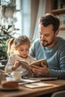 © Oscar - Father and young daughter at the kitchen table during breakfast, she reading a book while he drinks coffee,