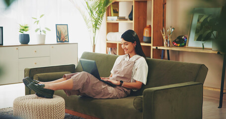 Poster - Relax, happy and laptop with woman on sofa for social media, reading blog and streaming service. Networking, email and communication with person in living room at home for online news and website